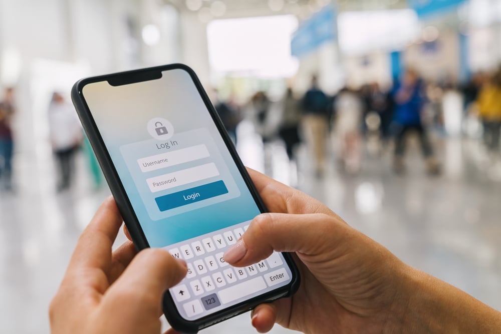 Hands holding phone to login