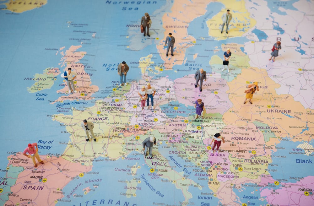People figurines over different EU countries on a map