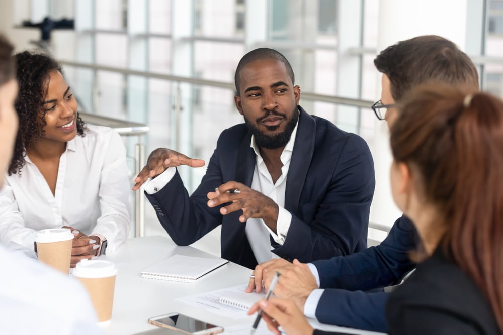 Man explaining something in a management meeting