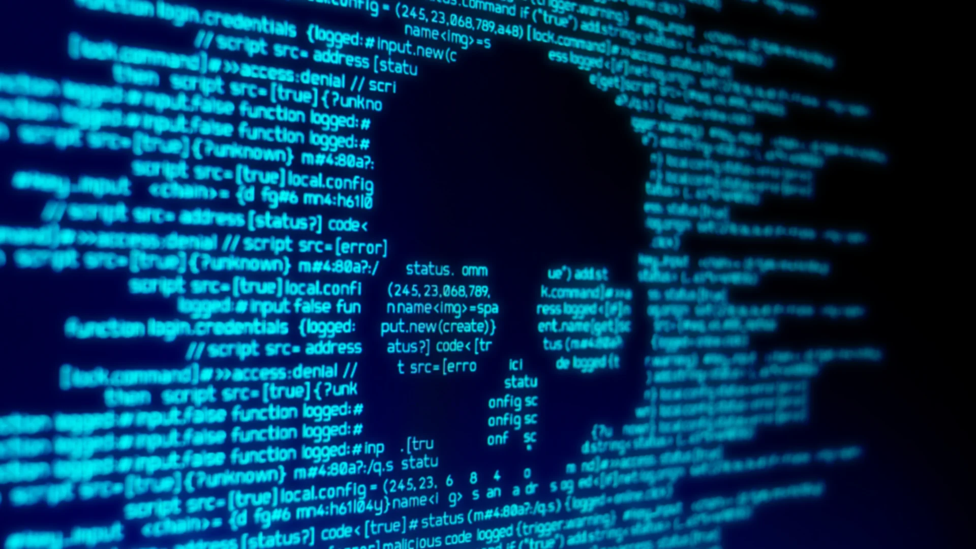 Computer code on a screen with a skull representing a computer virus